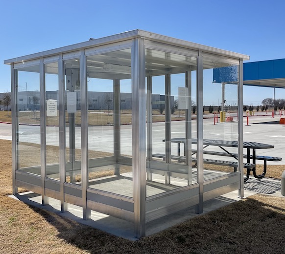 employee smoking shelter outside of warehouse