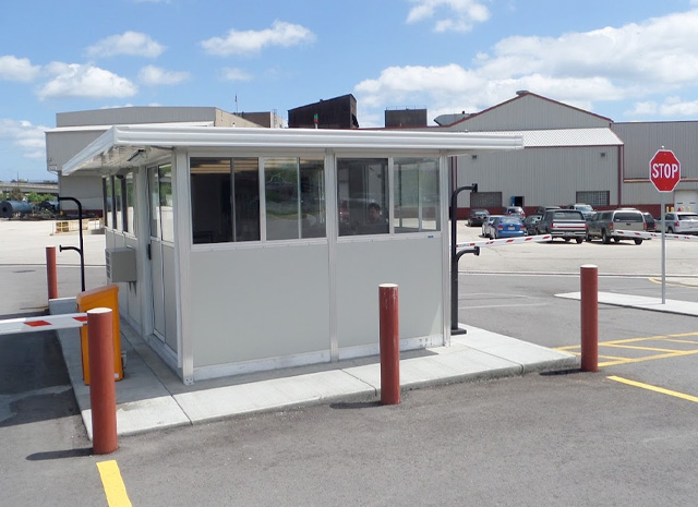 a guard booth placed in a parking lot