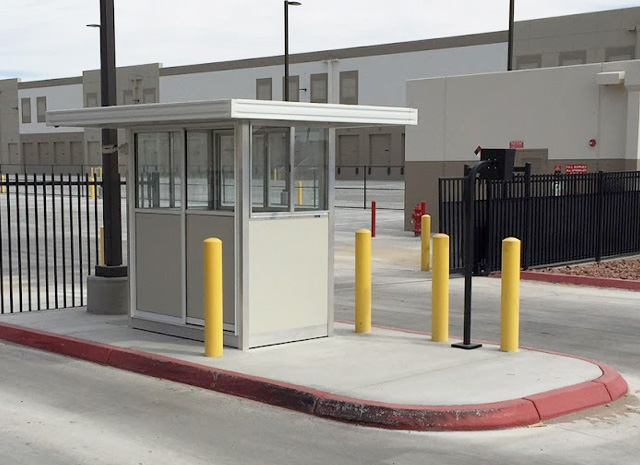 a guard shack sized for a single guard set at a gated entry point