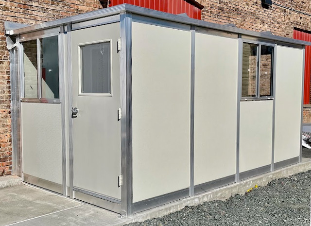 a small office set up to handle receiving paperwork inside or outside a large office