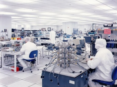 image of scientists with high-tech microelectronics