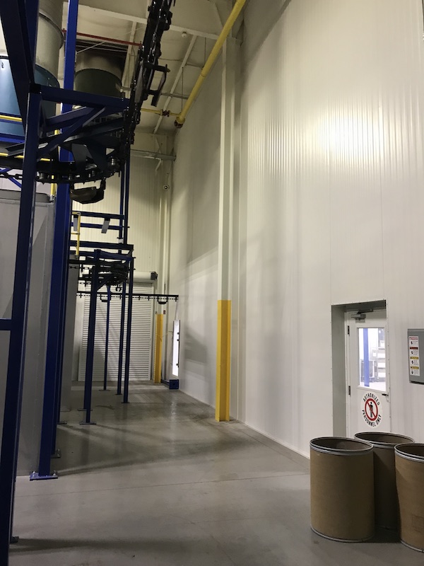 xtra-tall demising wall in manufacturing plant